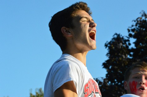 During the parade on Sept. 19, Dominick Farino cheers in excitment while on the cross country parade.