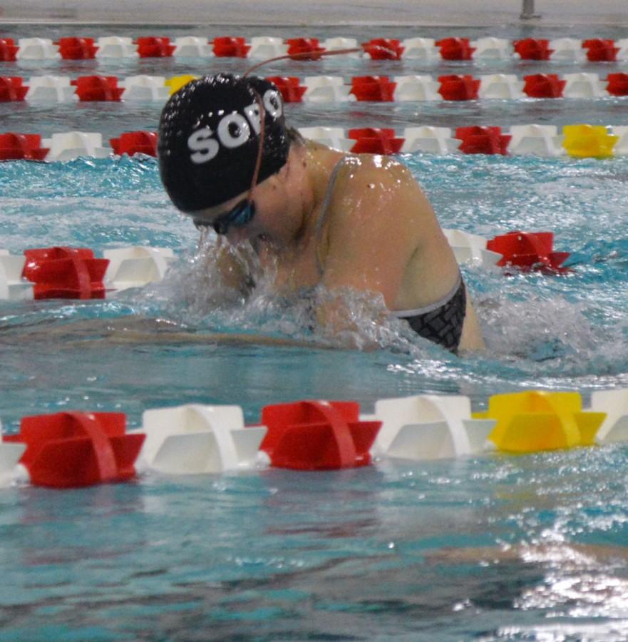 Sophomore Emma Lattimore swims the breast stroke during practice. Lattimore is a part of the record setting relay team that scores a good amount of points for the team.