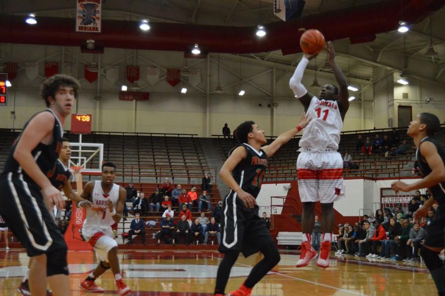 Senior Malik Bennett pulls up for a jump shot while being covered by a Park Tudor defender. Bennett attended Pike during his freshman season. 