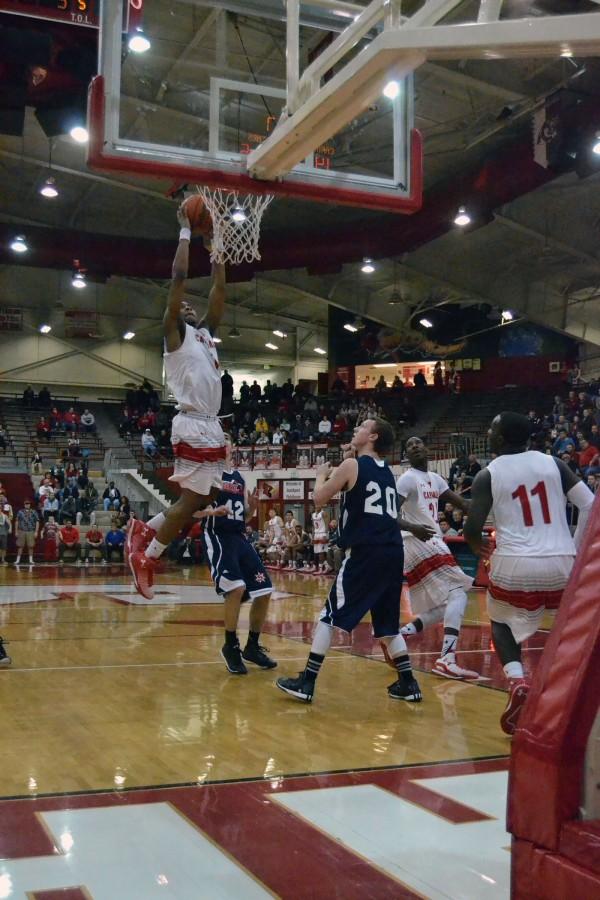 Sophomore Paul Scruggs attempts to dunk the ball against Bedford North Lawrence. Scruggs had 36 points that night and 10 rebounds 8 assists and five steals.