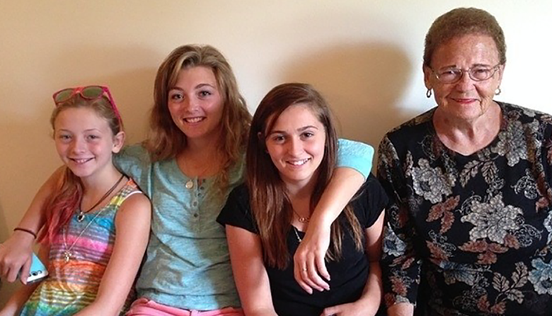 Senior Alicia Jones (middle left) sits with her sister, cousin, and great-grandmother.