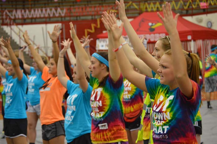Junior Jaclyn Boyer and sophomore Emily Patrick raise their hands to dance to the beat on April 17. 
