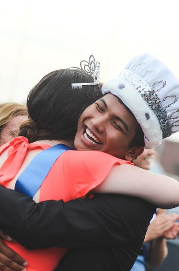 After announcing 2015 king and queen, Dave Bawi hug Sara Allman to congratulate her.