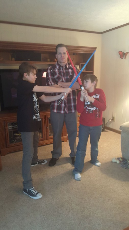 David+Luers+and+his+sons+James+%28L%29+and+Payton+%28R%29+share+a+love+of+Star+Wars.+Luers+has+seen+the+newest+movie+six+times.+Photo+contributed+by+David+Luers