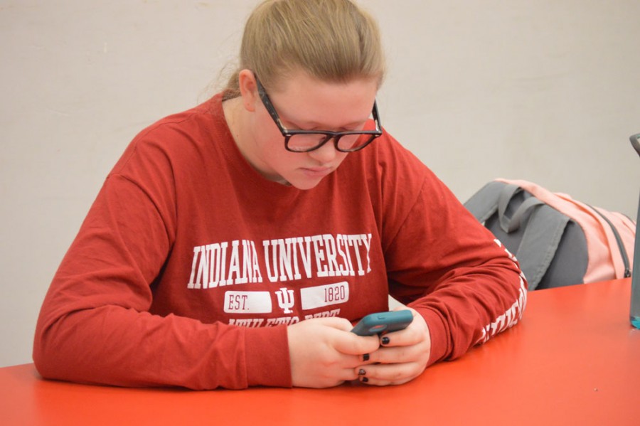 Sophomore Rachel Trammell sits in study hall, playing on her phone.