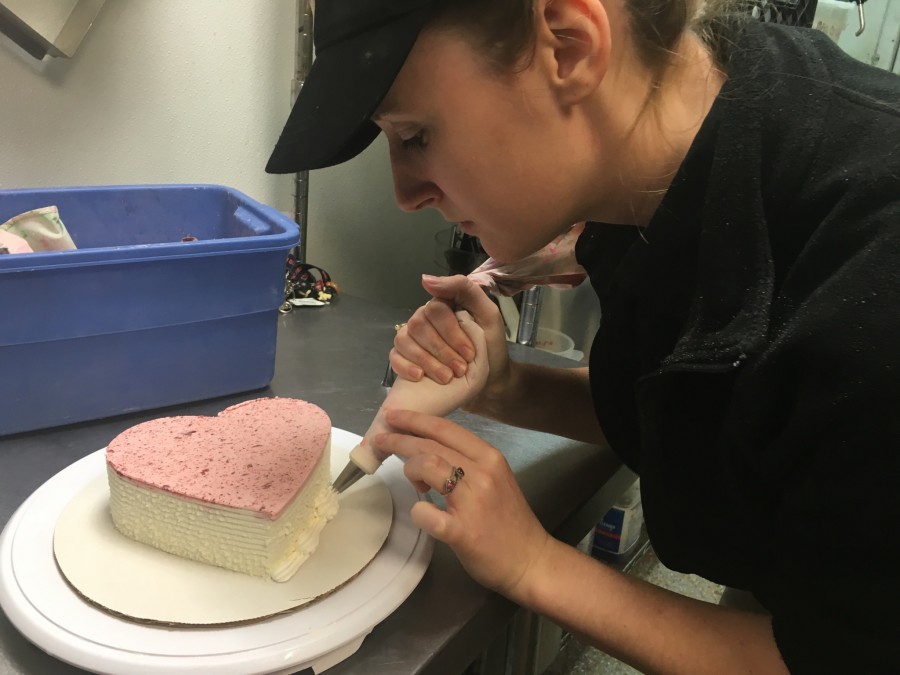 Graduate Rachel Patterson decorates Cupid cakes at Dairy Queen on Friday, Feb. 5.