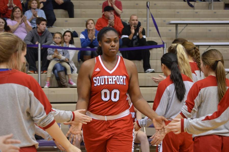 Junior Jaelencia Williams walks out after being announced as a starter during the county tournament against Ben Davis. Williams earned a starting role after just only playing basketball for four years.