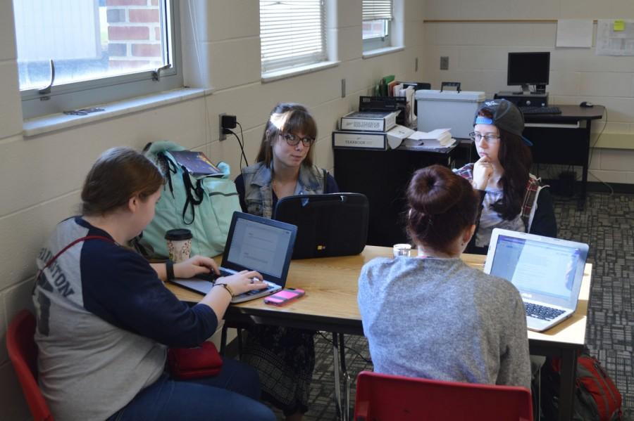 Juniors Gabby Rickets, Holly Pruit, Katie Beard and  Calista Richardson work on assignments in Sam Hanleys AP language and Composition class. 