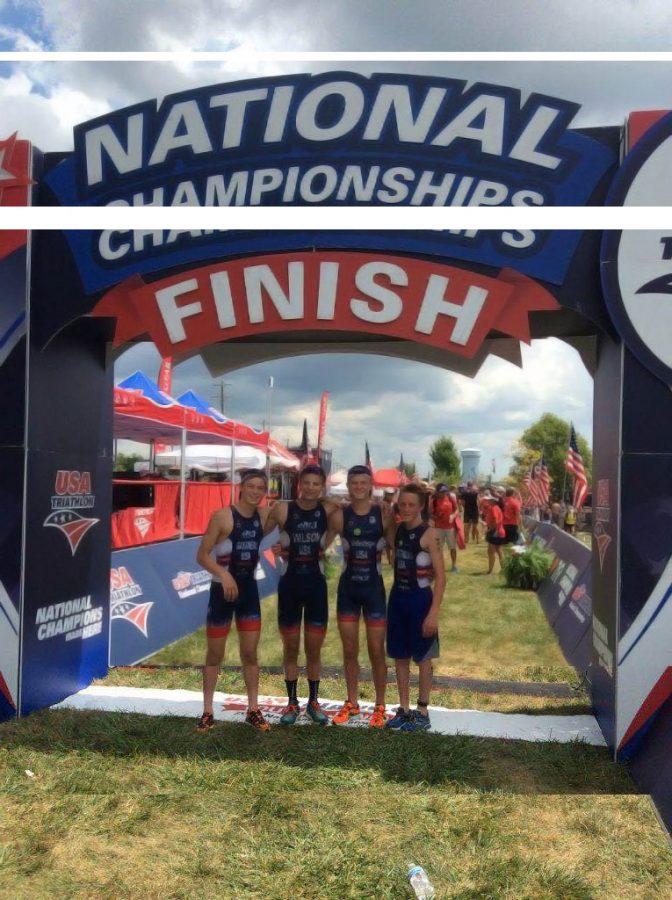 Freshman Drew Shellenberger (second from right) stands with his teammates after finishing second in the National Youth Triathlon Championship. Shellenberger will compete in cross country and swimming this year at SHS.  
