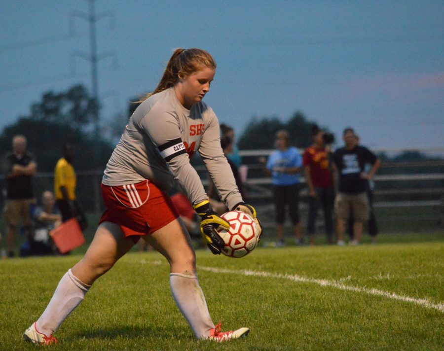 Junior goalie Emily Chambers prepares to punt the ball. Chambers has been on varsity for the past two years. 
