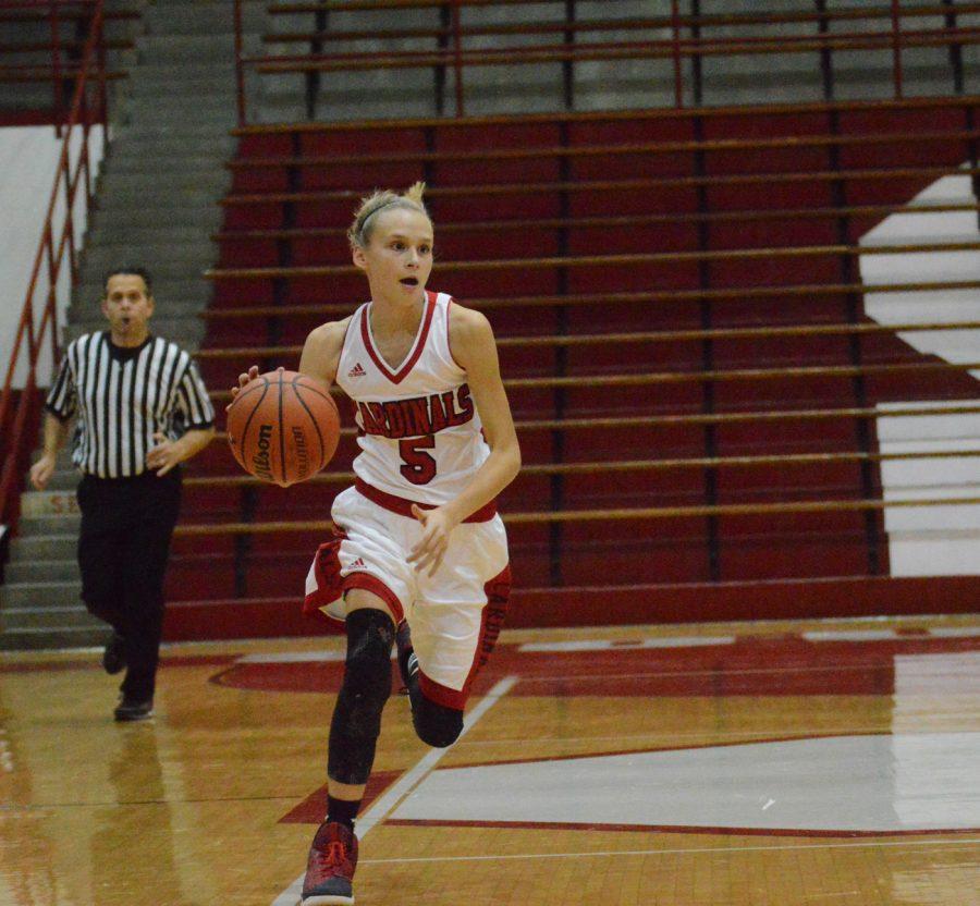 Freshman Lexie Green takes the ball up the court against Northwest on Nov. 22.