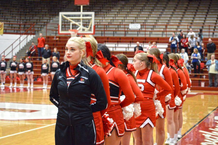 Sydnie+Vanvolkenburgh+and+cheerleaders+stand+in+formation+for+the+national+anthem+at+the+boys+basketball+game+against+Terre+Haute+South+on+Feb.+17.
