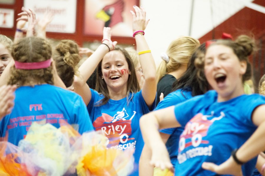 Sophomore Hollynd Givens claps and dances in a crowd. This was Givens’s first year on the RDM committee. 