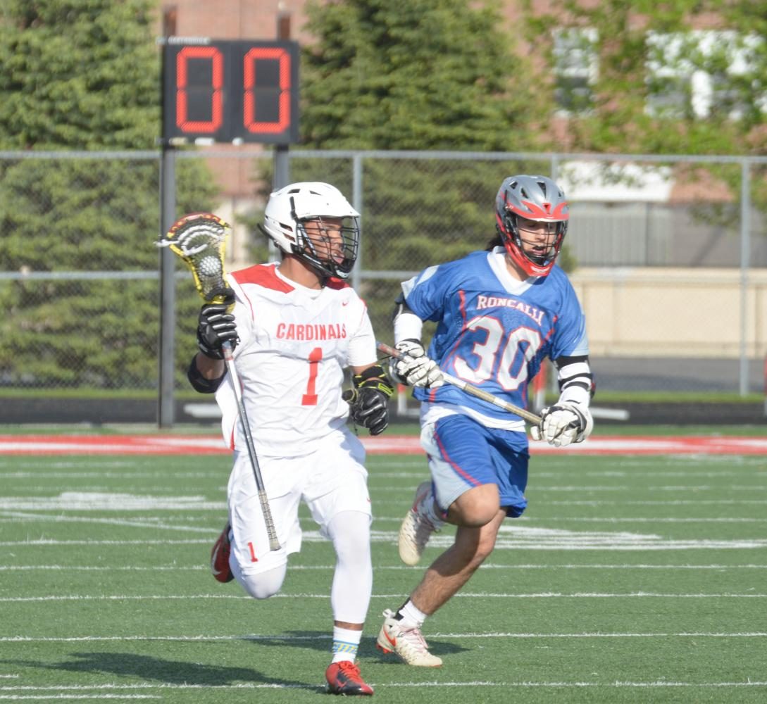 Senior Norsie Martin sprints down the field towards the goal. Martin is one of the seven seniors on the lacrosse team. 