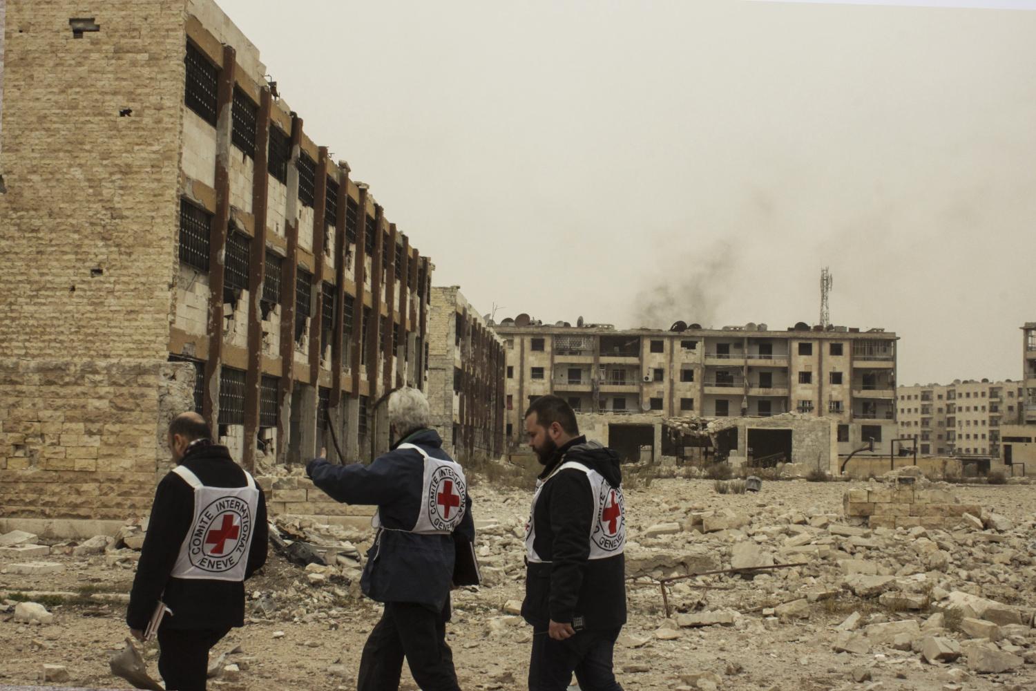 Three International Committee Red Cross members evaluate the rubble of a conflict-affected area in Syria. They were checking the living conditions
in order to determine when civilians can live there again. Despite taking no part, millions of innocent civilians face the consequences of the war,
with hundreds of thousands of casualties, and many more seeking safety and becoming refugees.