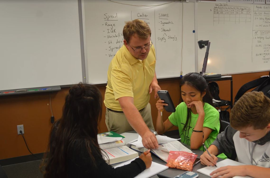Math teacher Jack Williams tutors math students after school.
