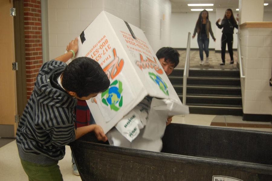 Green Earth Society members dump the recycling bins in larger crates on Fri, Dec. 8.