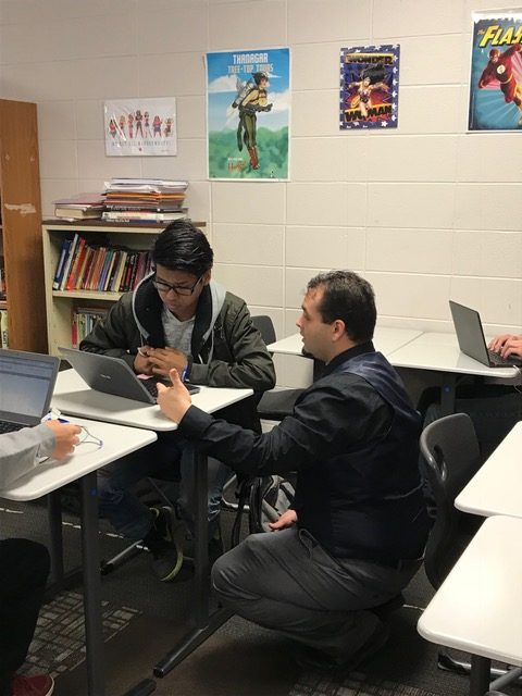 On Jan. 17, new English teacher Rico Gonzales helps a student with his work. Gonzales is a new member of the SHS staff. He says that SHS drew him in with the schools mission statement and and the freedom and trust in the environment. 