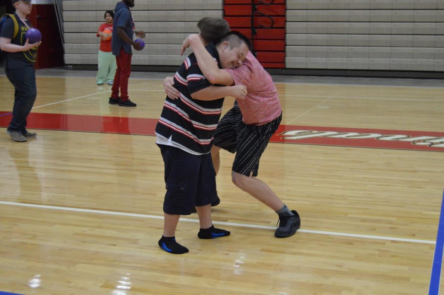 Junior Abel Tajonar (left) and sophomore Nathan Taylor (right) hug during an activity in their PE class on Aug. 10. 