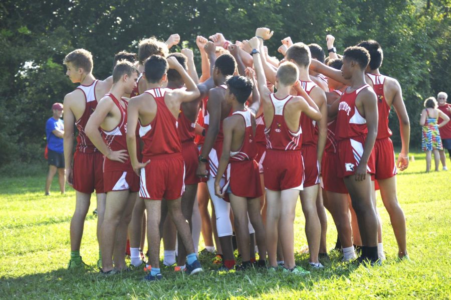 The SHS boys cross country team prepares to run by breaking down before the race on Tuesday, Aug. 28.