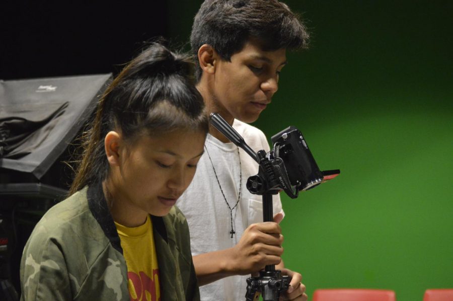 Senior Chin Chin (left) and junior Edwardo Casimiro Vega (right) work together in the Mass Media class. This is the second year for Mass Media. 