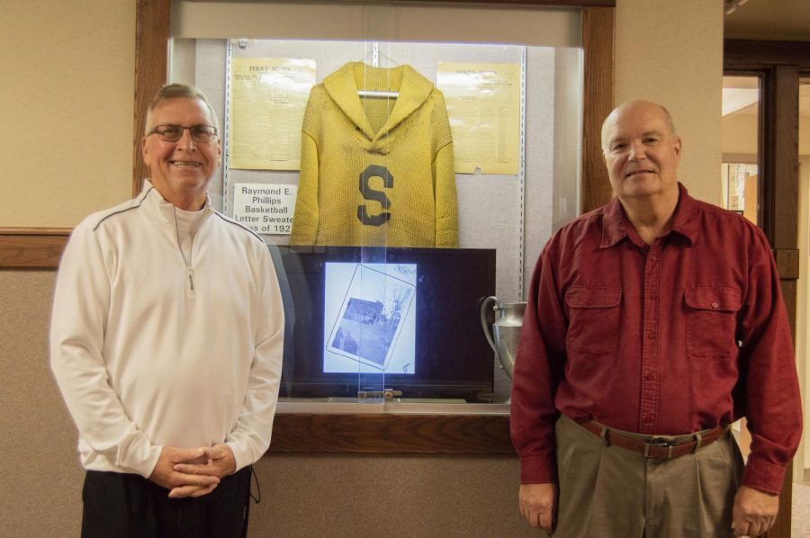 David Ladd (left) and Barry Browning have worked to take care of the SHS Alumni Association Room, which they call a showcase of Southport memorablilia. Both men have collected memorabilia and hope to share their displayed items with the community. 