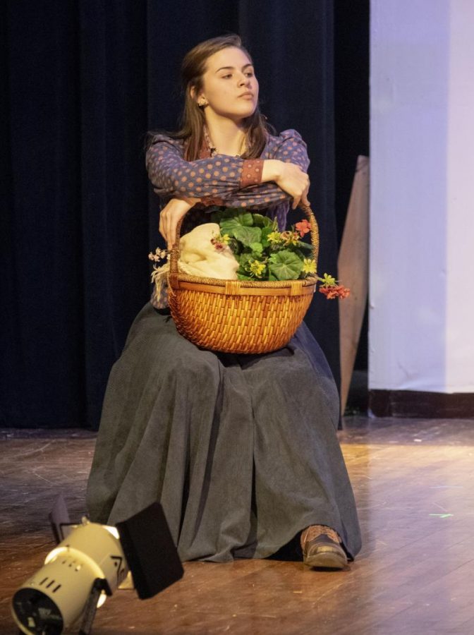 Junior Lilly Leslie, dressed as Eliza Doolittle, acts on stage during a dress rehearsal on Nov. 12. Leslie is the lead in the SHS fall musical, My Fair Lady.