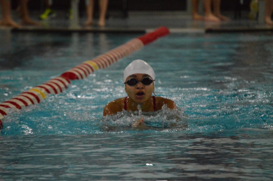 Junior Kiara Moore swims in the girls 200 yard individual medley in  the Cardinal Classic on Dec. 1. The girls finished first in the competition with 290 points. 