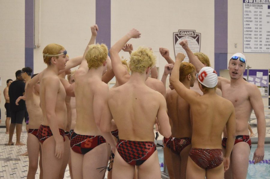 The boys swim team breaks it down after wining their last regular season meet against Ben Davis on Feb. 5.