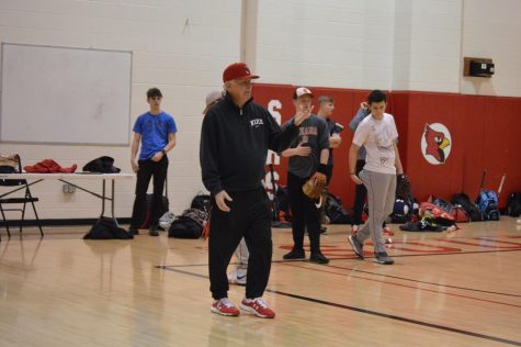 New head coach Phil Webster coaches art a practice on March 7.