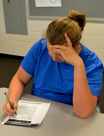 Junior Tom Stukkagan works on a pre-written exam provided by College Board as part of the student pilot program.