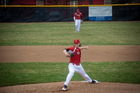 Senior Avery Short pitches against Terre Haute South on April 5.