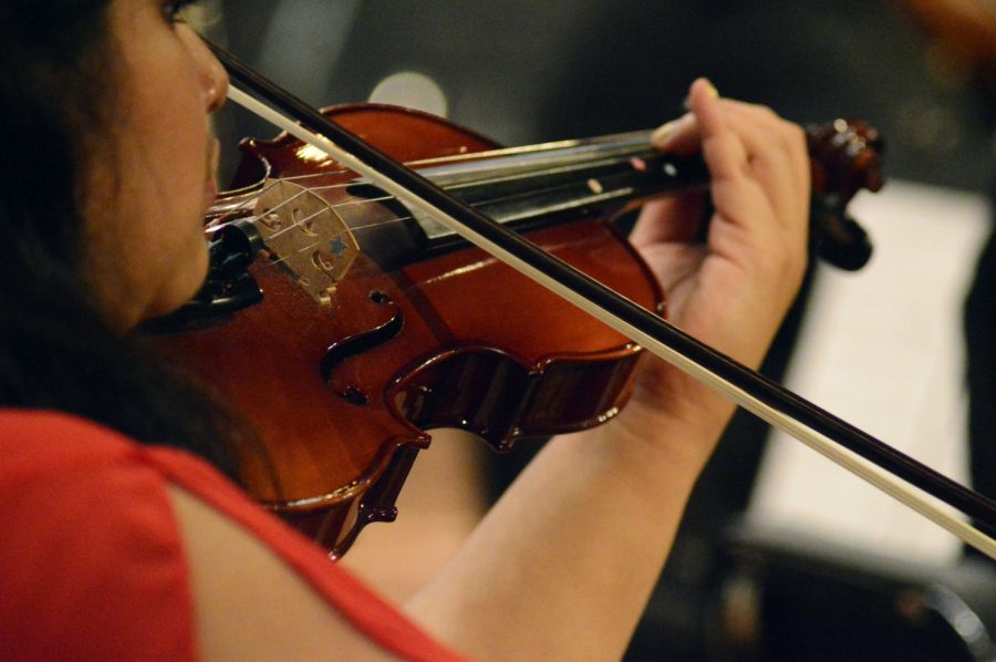 Senior Esmeralda Tello-Tello plays the violin at Extravaganza on Fri, May 17.
