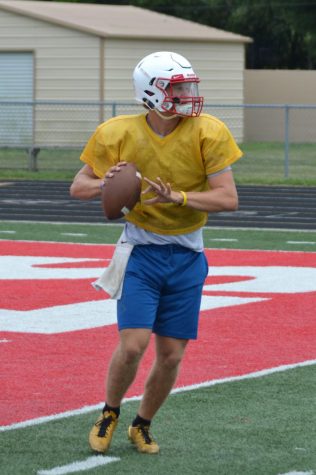 Senior Ryan Lezon prepares to throw a ball at practice. With two years of varsity football under his belt, Lezon will switch thins up by taking on a new position for the 2019 season. 
