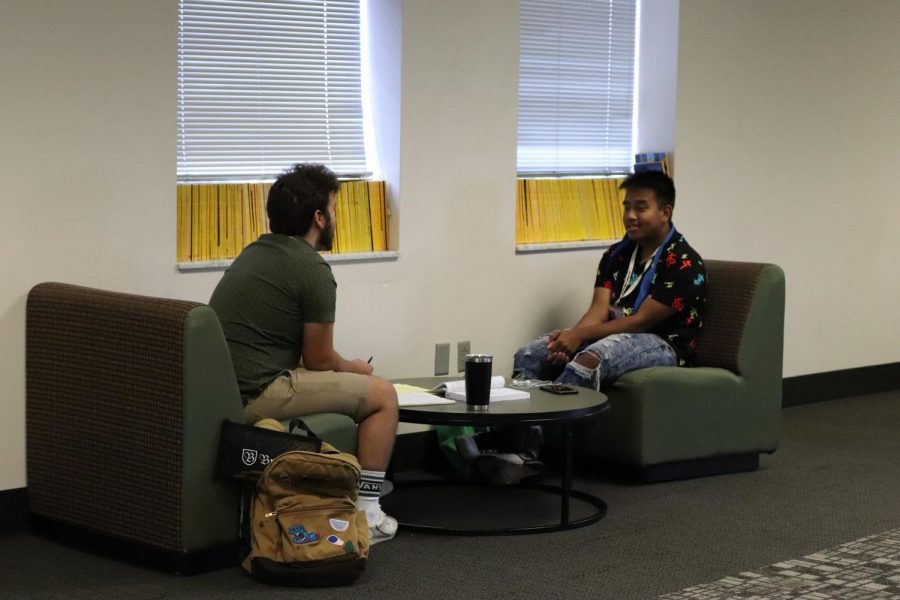 Seniors Giovani Buchanan and Cung Cem hang out and finish homework in the senior lounge. The senior lounge was introduced this school year.
