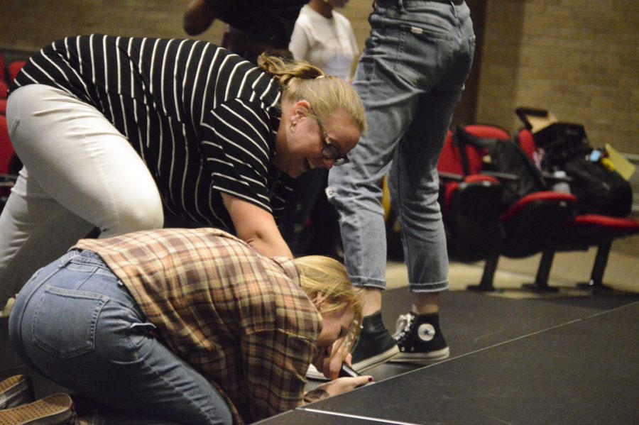 Richardson helps senior Marsela Riddle. Richardson helps with students during show choir practice.