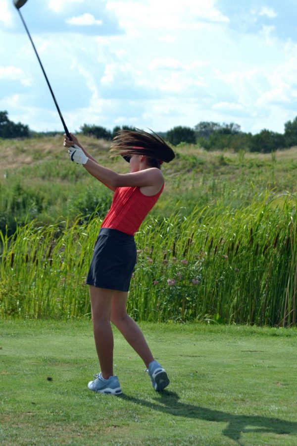 Sophomore Annika Chan swings on the third hole of the first round against Ben Davis. Chan’s drive barely made it past the water and saved her from losing a stroke. Chan had a career nine-hole low of 40.