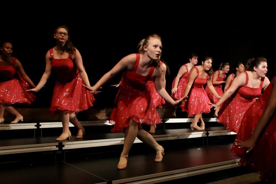 Senior Marsela Riddle dances during the show choir concert. Riddle has been singing and dancing in show choir for two years. 