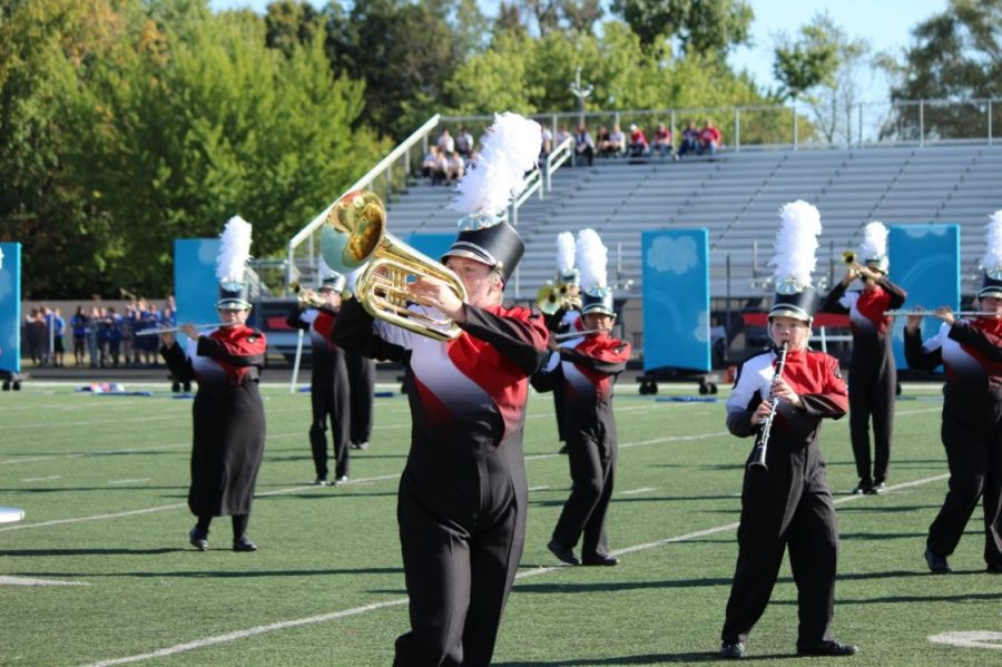 Junior Madison Sprague marches during the ISSMA competition. Sprague has been in marching band since she was a freshman.