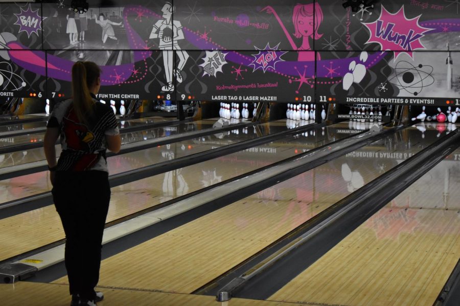 Madison Woodmansee watches as she bowls a strike. She had five strikes in her second game. 