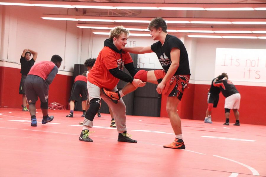 Luke Goodwin and senior Josh Moore practice with each other on Jan. 30. Goodwin won first place in conference on Jan. 18.