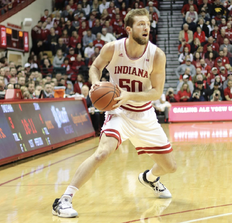 Joey Brunk looks for an opening in the defense against the University of Iowa on Feb. 13. Indiana University won with a final score of 89-77. 