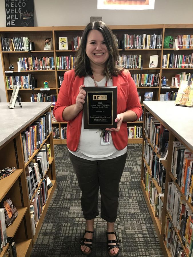 Media specialist Tara Foor holds the award. SHS competed with other schools around the state for the award.