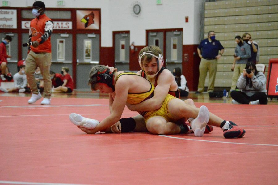 Senior Luke Goodwin wrestles his opponent during the first match of the Conference Indiana tournament. Goodwin placed second in the tournament, and his points helped lead the team to a fourth place finish. 