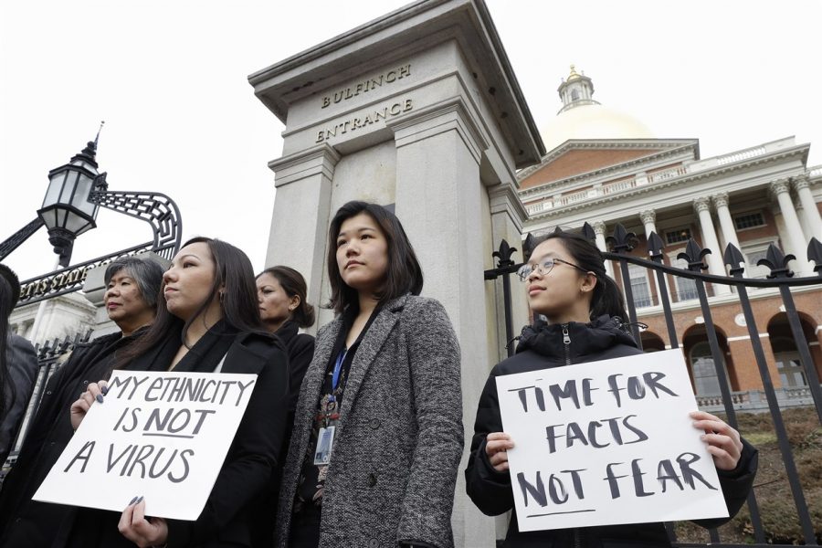 Protesters protest at the Statehouse of Boston on March 12, 2020. The rise in crimes against Asians stemming from the Corona virus have led to other protests around the country. 
