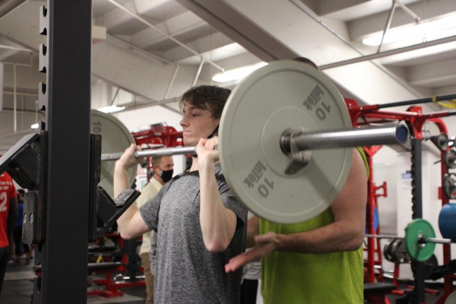 Track runner lifts weights to get ready for the teams first meet on April 6. After losing their indoor season this year, the track team has had offseason workouts in order to stay in shape.