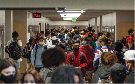 Students walk through the social studies hallway during passing period. SHS is now requiring masks during school. 