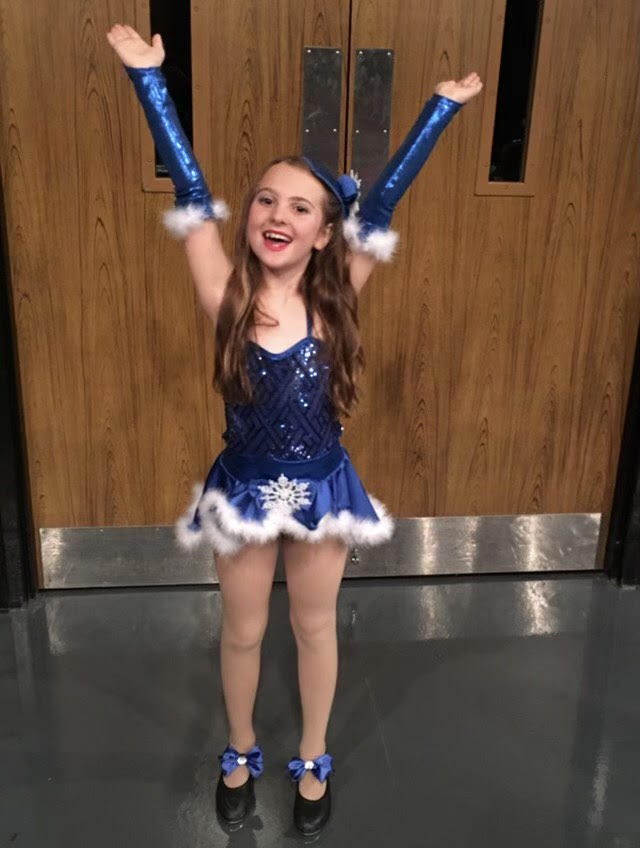 Freshman Sophia Barker (as a child) shows off her tap dancing costume. Shes been dancing since she was a child. (Photo contributed by Sophie Barker)