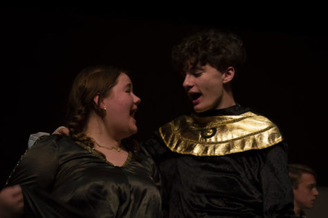 Juniors Annabelle Shrieves and Grayson Meece sing along together during rehearsals of the fall musical, Once Upon a Mattress. They say that performing without masks is somwething new for them.