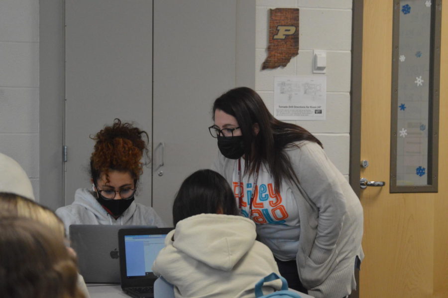 Business teacher Ashley Quinlan helps students with their work on January 19. She looks forward to the school year.